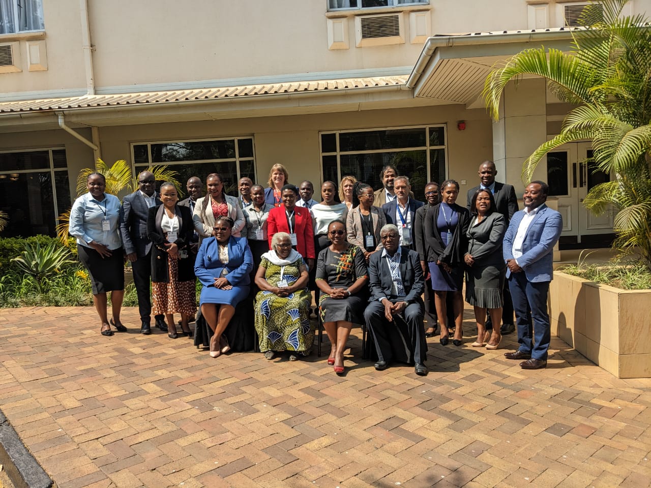 A group photo taken to commemorate the consultative meeting promoting the ratification of the AU Protocol on social protection and social security in Lusaka, Zambia.